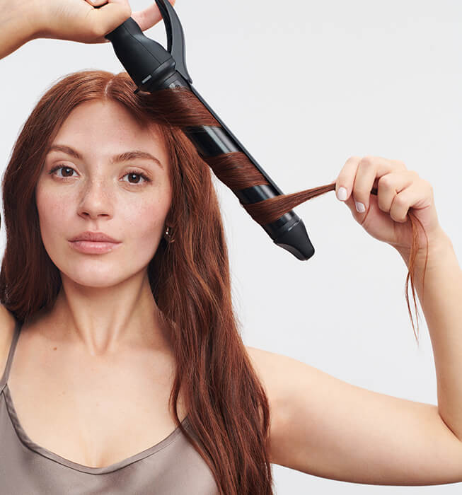 Model with Long Barrel Curling Iron